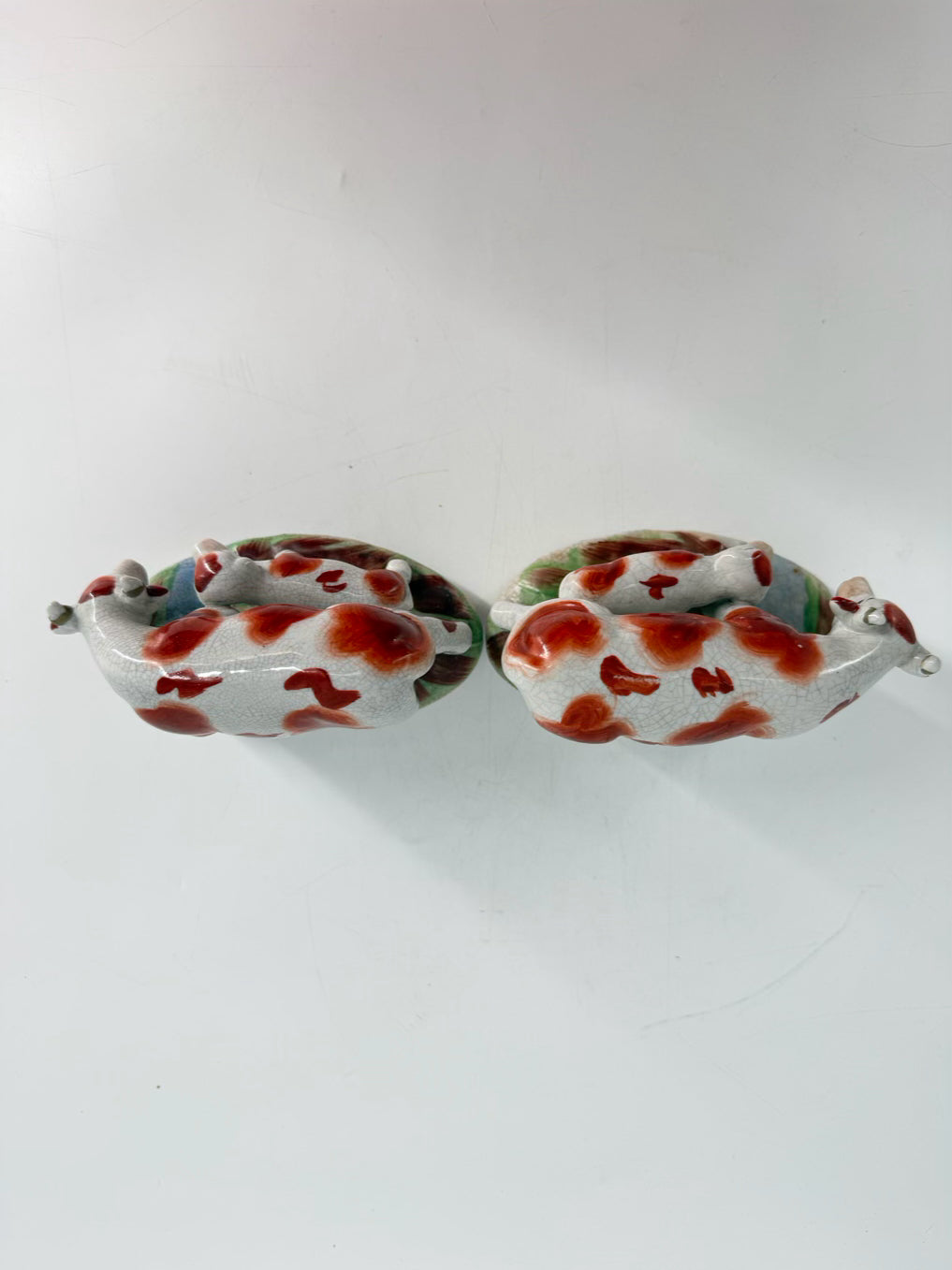 White & Rust Pair of Cow Figurines