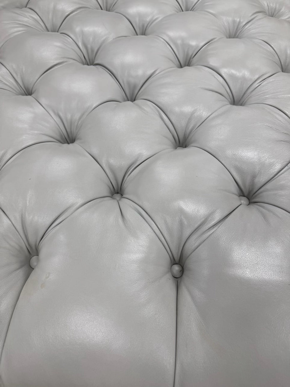 Gray Leather Look Tufted Ottoman