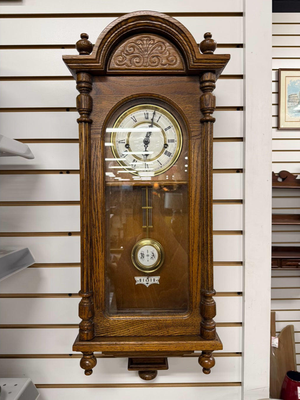 HOWARD MILLER Medium Oak Wall Clock
