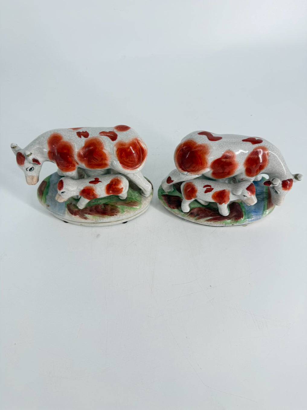 White & Rust Pair of Cow Figurines