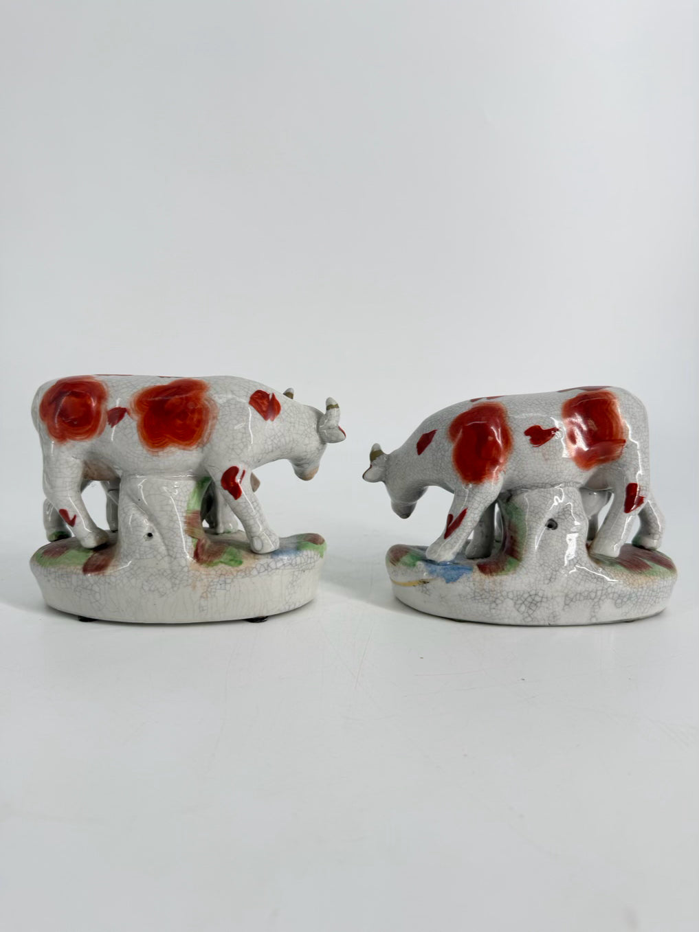 White & Rust Pair of Cow Figurines