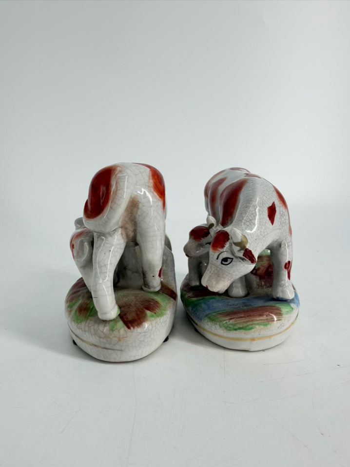 White & Rust Pair of Cow Figurines