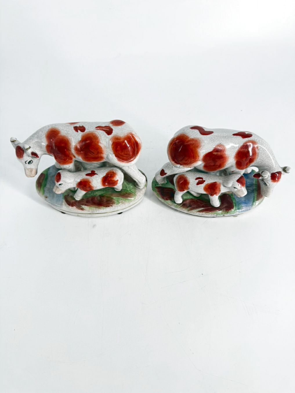 White & Rust Pair of Cow Figurines