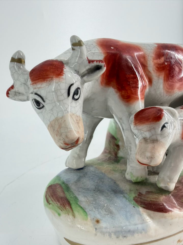 White & Rust Pair of Cow Figurines