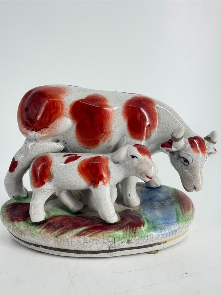 White & Rust Pair of Cow Figurines