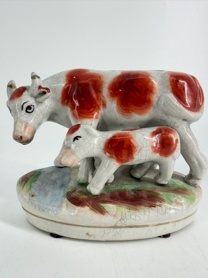 White & Rust Pair of Cow Figurines