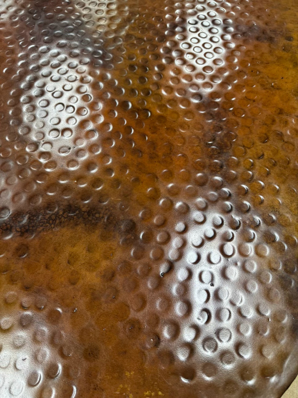 Copper Look Oval Dented Coffee Table