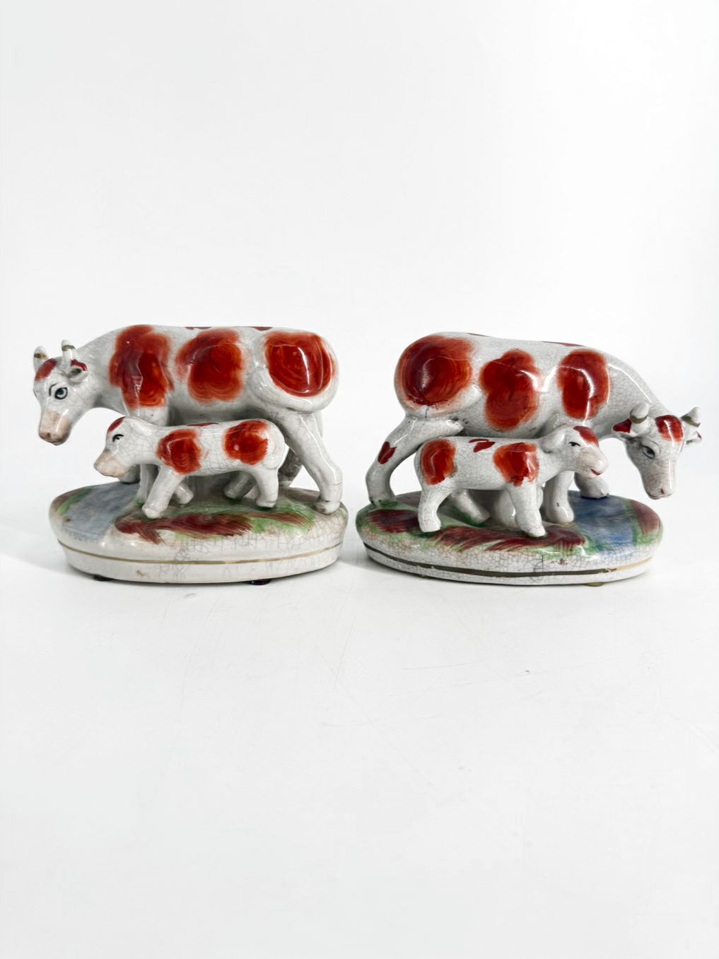 White & Rust Pair of Cow Figurines