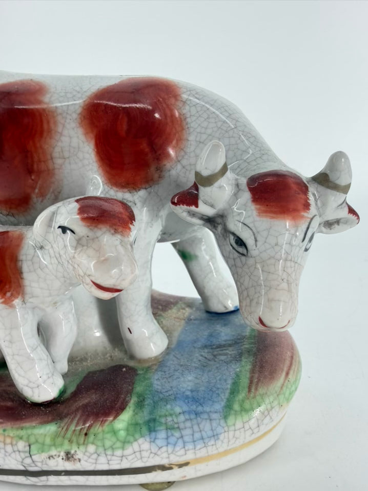 White & Rust Pair of Cow Figurines