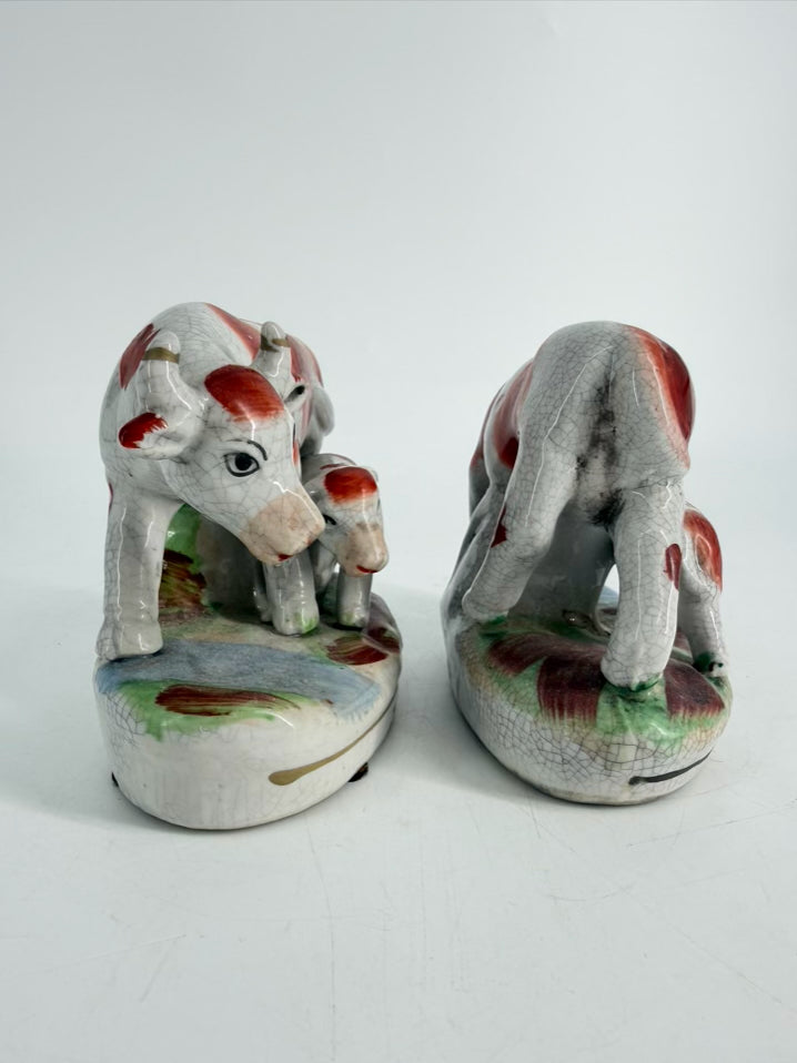 White & Rust Pair of Cow Figurines